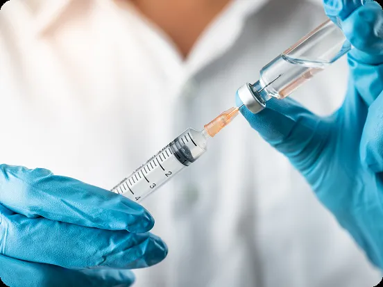gloved-hands-filling-syringe gloved-hands-filling-syringe