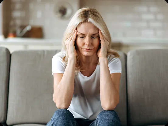 woman-headache-couch woman-headache-couch